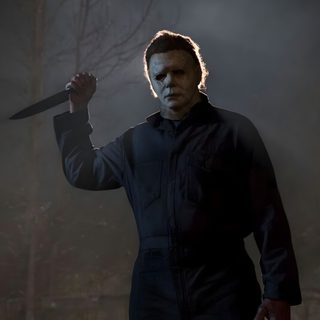 a man holding a knife in the dark Halloween Kills dark slate gray