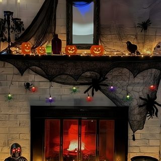 a fireplace decorated with halloween decorations and lights Halloween Fireplace dark olive green