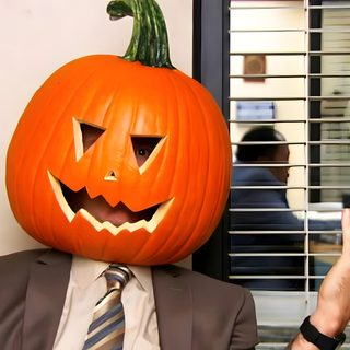a man in a suit and tie with a pumpkin on his head Dwight Halloween Pumpkin Spice Gif, The Office Halloween, The Office Pumpkin, indian red
