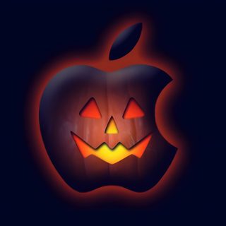 an apple with glowing pumpkin faces in the dark Halloween Apple Watch Face Mac Halloween, Apple Logo Pumpkin, Apple Iphone Halloween, black