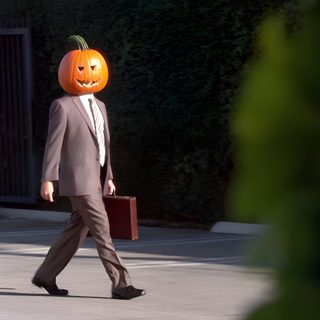 a man in a suit walks down the street with a pumpkin on his head Dwight Halloween The Office Halloween Quotes, The Office Pumpkin, Dwight Schrute Pumpkin Head, black