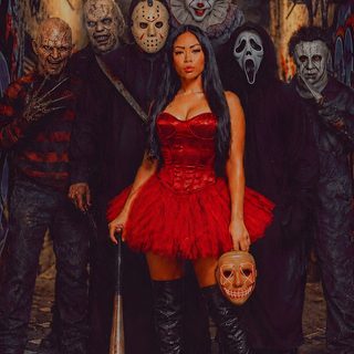 a woman in a red dress holding a pumpkin Halloween Baddie black