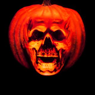 a movie poster for halloween ii the nightmare isn't over with a skull and pumpkin Halloween 2 Halloween 2 Movie Poster, Halloween 3 Poster, Halloween 2 Movie, Halloween 2 Poster, black