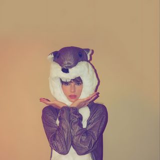 a woman wearing a costume with an animal on her head and hands in front of her face Taylor Swift Halloween Taylor Swift Halloween Aesthetic, Taylor Swift Thanksgiving, Halloween Taylor Swift, rosy brown