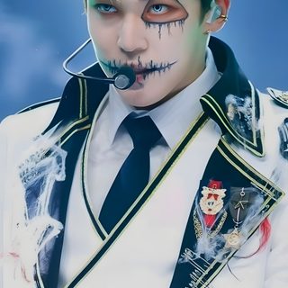 a man with makeup on his face wearing a white suit and black bow tie, holding something in his hand Ateez Halloween Ateez Demon Line, Kpop Demon Hunter Makeup, Wooyoung Halloween Ateez, dark gray