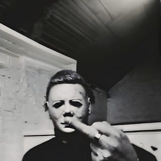 a man in black shirt pointing at something with his finger on the wall behind him Halloween Middle Finger Funny Movie, Horror Character, Michele Myers, Michael Myers Middle Finger, black