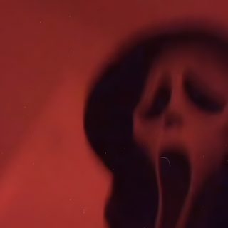a person with their mouth open in front of a red wall Halloween Ios16 maroon