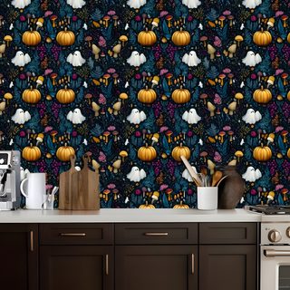 a kitchen wall with pumpkins and ghost heads on the wall next to an oven Halloween Kitchen dark slate gray