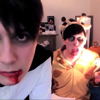 two people dressed up in costumes and one has blood on his face while the other holds a cell phone Dan And Phil Halloween 2009 Frank Horrigan Gif, Dan And Phil Nun Costume, Phil Lester Halloween, indian red