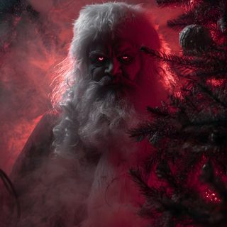 a man with long white hair and beard standing in front of a red light surrounded by trees Halloween Santa Claus Scary Santa, Gothic Fantasy Art, Dark Christmas, Scary Santa Claus, black