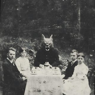 an old black and white photo of people sitting around a table with a dog on it Old Scary Horror Halloween Horror History, Old Creepy, Cool Horror, Black And White Monsters, dark slate gray