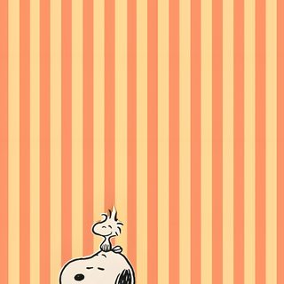 a cartoon dog sitting on top of a pumpkin Charlie Brown Halloween Iphone light salmon