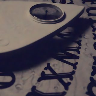 a clock sitting on top of a table covered in letters and numbers that spell out the time Halloween Ouija Planchette Paranormal Aesthetic, Paranormal Pictures, Rapper Iphone, dim gray
