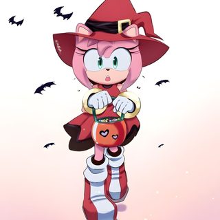 an image of a cartoon character dressed as a cat with a pumpkin in her hand Amy Rose Halloween Amy Rose Halloween Costume, Amy Rose Skeleton, Sonic And Amy Halloween, lavender blush