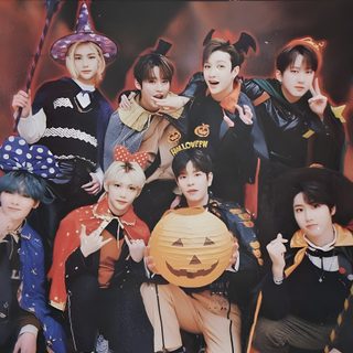 the group is posing for pictures together in front of a red background with black and white squares Straykids Halloween Skz Thanksgiving, Stray Kids Thanksgiving, Stray Kids Fall, Fall Skz, dark slate gray