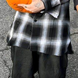 a man holding a pumpkin in his hands Billie Eilish Halloween Billie Eilish Fall, Billie Eilish Fall Aesthetic, Billie Eilish Halloween Costume 2023, dark olive green