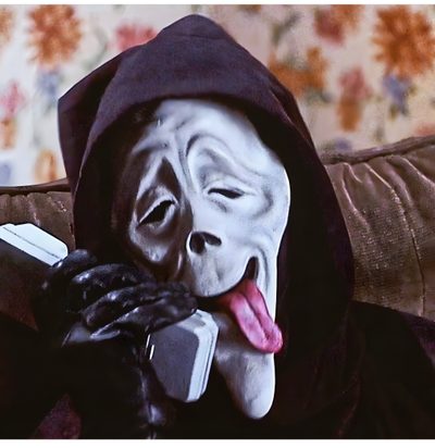 a person wearing a mask and holding a cell phone to their face while sitting on a couch Halloween Scream Funny Funny Scary Movies, Marlon Wayans, Scary Movie Characters, dark slate gray