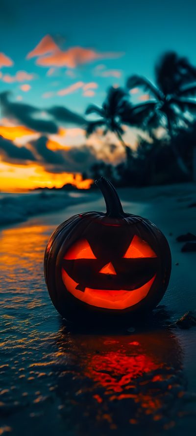 a carved pumpkin sitting on top of a sandy beach next to the ocean at sunset Beach Halloween Halloween Sunrise, October Beach, Fall Beach Background, Beach Halloween, dark slate gray