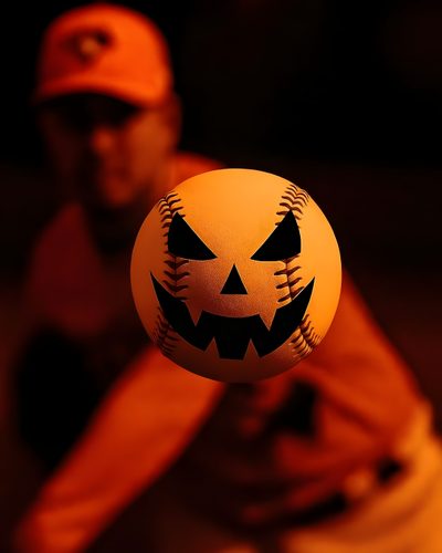 a baseball with a jack - o'- lantern face on it is in the air Baseball Halloween Event Planning Tips, Baseball Birthday Party, Dodgers Baseball, High Stakes, black