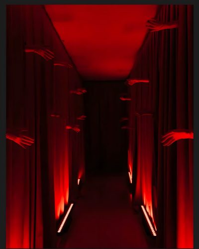 a long hallway with red curtains and lights on either side, leading to another room Halloween Hallway Scary Red Hallway, Halloween Horror Party Decor, The Great Gatsby, Creepy Halloween, black