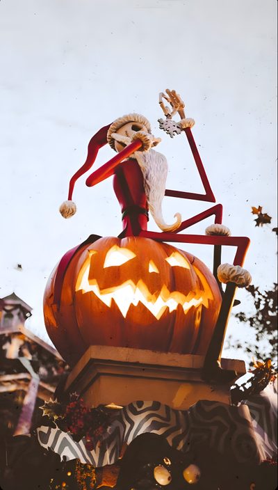 a statue of a skeleton sitting on top of a pumpkin in front of a sky background Walt Disney World Halloween Halloween Iphone Nightmare Before Christmas, Fall Aesthetic Nightmare Before Christmas, Halloween Town Nightmare Before Christmas, silver