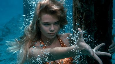 a woman in an orange swimsuit under water with her hands out to the side Halloween H20 H2o Mermaids Aesthetic, Real Mermaid, H2o Aesthetic, H2o, Aquamarine Movie, dark slate gray