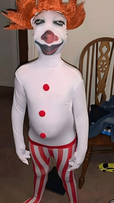a man dressed as a clown standing next to a chair Goofy Ahh Halloween Goofy Pennywise Costume Meme, Anatomy Drawing, Cursed Pennywise Costume Meme, sienna