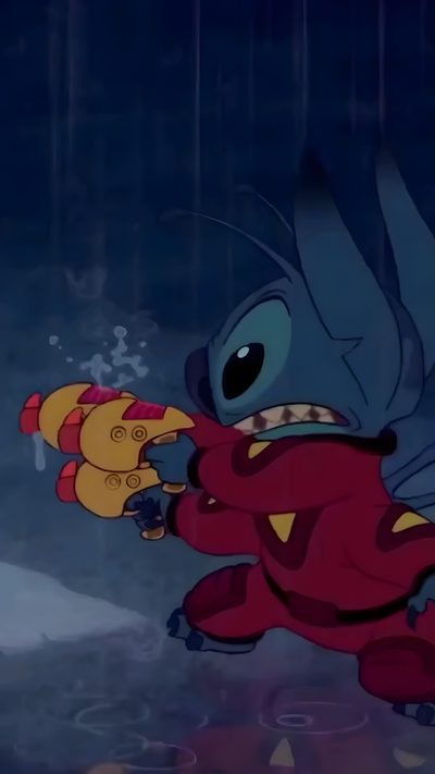 an animated character holding a toy in the rain Halloween Stitch Gif Lilo And Stitch Live, Lilo And Stitch Videos, Live Stitch, Stitch Live, midnight blue