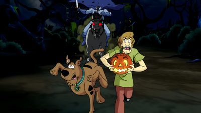 a man holding a pumpkin next to a dog on a leash in front of a full moon Scooby Doo Halloween Laptop Scooby Doo Scariest Episode, Scooby Doo Scary Episodes, Scooby Doo Scary Movie, black