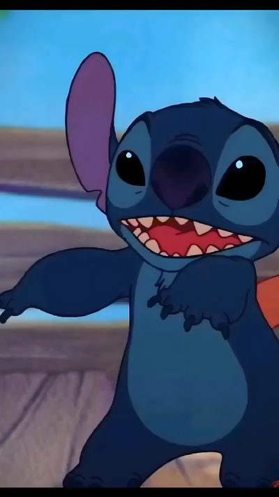 the stitcher is smiling and waving his arms in front of an orange ball with its mouth wide open Halloween Stitch Gif Stitch Dancing, Stitch Gifs Disney, Lilo And Stitch Videos, Live Stitch, dark slate gray