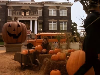 pumpkins and hay in front of an old building Halloweentown Pumpkin Halloween City Movie, Halloweentown Stills, Halloween Screencaps, saddle brown