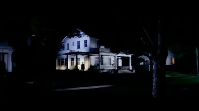 a large white house sitting in the middle of a forest at night with lights on Halloween 1978 4k Poltergeist House, Amityville Ghost Boy, Black Christmas 1974 House,