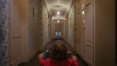 the woman is walking down the hallway with her hand up in the air as she takes a photo The Shining Laptop Halloween The Shining Movie Aesthetic, The Shining Stills, The Shining Scene, dark olive green