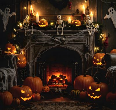 a fireplace decorated for halloween with skeletons and pumpkins Halloween Fireplace Halloween Fireplace, Halloween Fireplace Ambience, Halloween Fireplace Decor Pumpkins, black