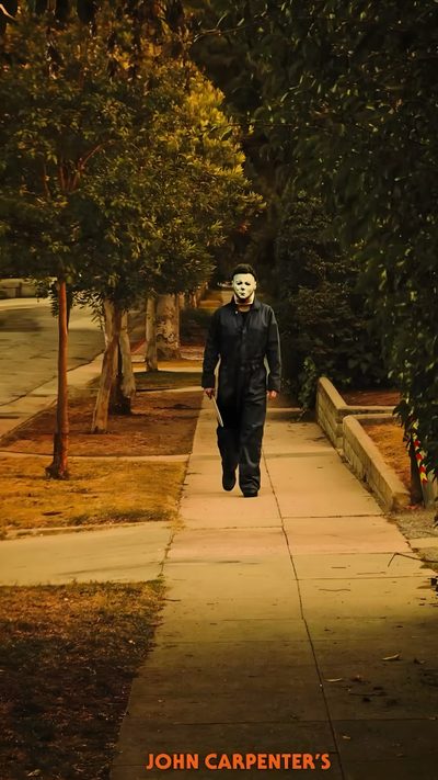 a man walking down a sidewalk with a mask on his face and the words john carpenter's John Carpenter Halloween John Carpenter, dark olive green