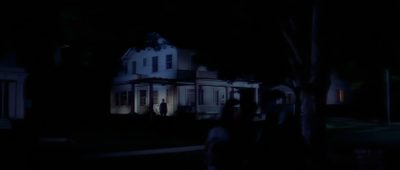 a house lit up at night with people walking in the front yard and on the sidewalk Halloween 1978 4k Halloween 1978 Halloween 1978 Michael Myers House, Halloween 1978 4k, Halloween 1978 Background, black