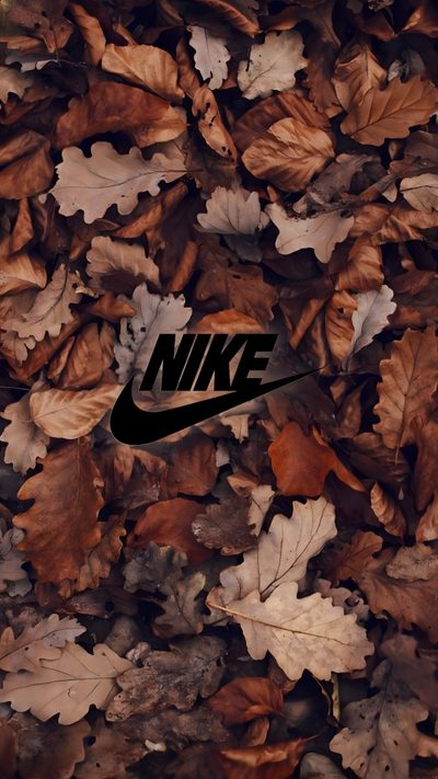 the nike logo is surrounded by leaves and other autumn foliage in this artistic photo taken on november 11, 2012 Nike Halloween Iphone Festival, Nike, Best Nike For Iphone, Pixar, The Borrowers, Pixel Art, dark olive green