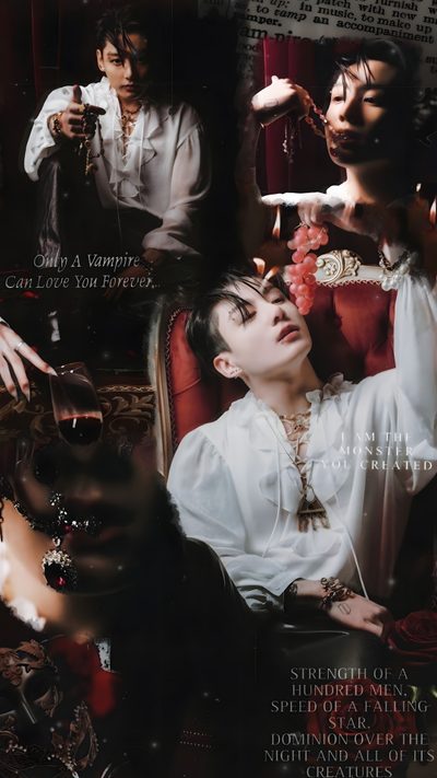 a man sitting on top of a red chair next to a woman in a white dress Jungkook Halloween Vampire Jungkook, Jungkook Vampire, Vamp Jungkook, Jungkook As Vampire, black