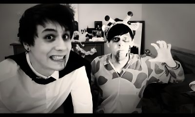 two people dressed up in costumes posing for the camera while one person is holding out his hand Dan And Phil Halloween 2009 Dan The Dinosaur, Demon Giraffe, Dinosaur Dan, Zombie Giraffe, dim gray