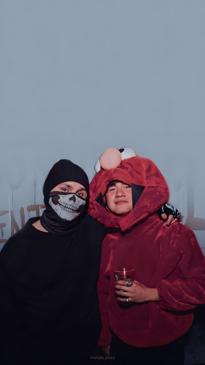 two people dressed in costumes pose for a photo with their arms around each other, both wearing face paint 5sos Halloween 5sos Halloween, 5 Seconds Of Summer Photoshoot, 5 Seconds Of Summer Group Photo, light slate gray