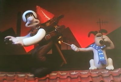 two animated dogs standing on top of a roof next to each other in front of a red light Wallace And Gromit Halloween Hd Wallace And Gromit Car, Wallace And Gromit Dog, Wallace And Gromit London, dark olive green