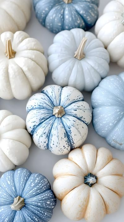 blue and white painted pumpkins on a table Pastel Blue Halloween Fall Pumpkin Iphone, Blue Fall Aesthetic, Blue Fall Theme, Blue Pumpkin Decor, silver