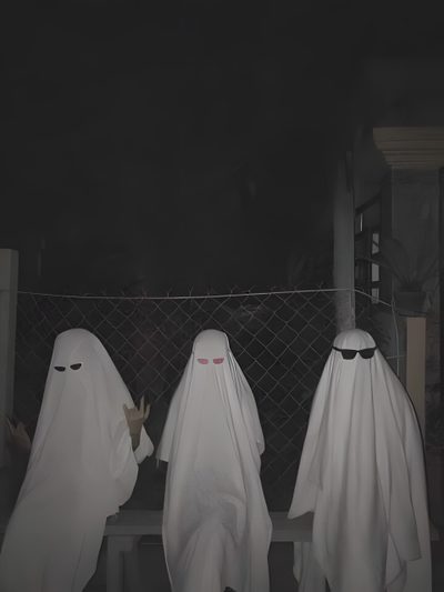three people in white ghost costumes standing next to each other on a fence at night Halloween Not Blurry Three Ghosts Aesthetic, 3 Ghost Aesthetic, Ghost Trio, dark slate gray