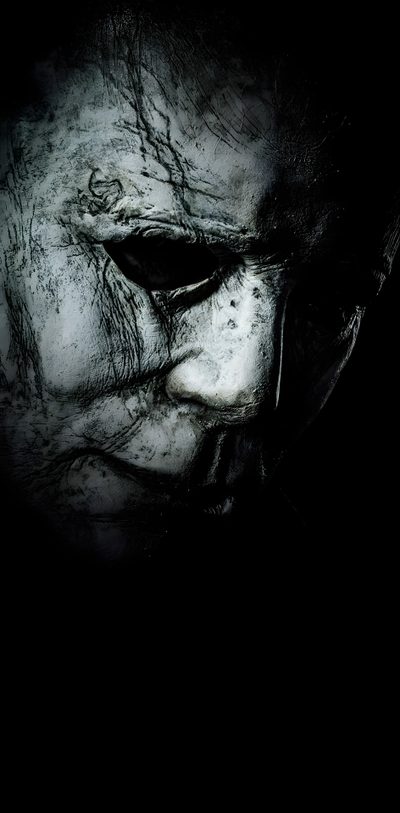 an evil looking man in the dark Halloween 2018 Michael Myers Michael Myers’s, Halloween Iphone Michael Myers, Android Michael Myers, black