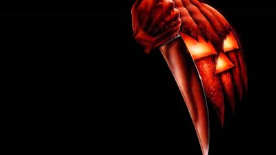 a hand holding a lit up pumpkin with glowing eyes and hands in the shape of an angel Bing Halloween Pumpkin From Halloween Movie, Halloween Movie Jack O Lantern, Horror Movie Jack O Lantern, black
