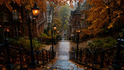 an alleyway in the fall with leaves on the ground and street lamps lit up Halloween Town Background Have Inspiration, Autumn Scenery, Dream City, Autumn Aesthetic, Best Seasons, black