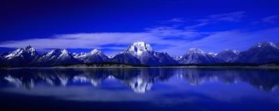 the mountain range is reflected in the still waters of the lake, with blue skies and white clouds Dual Monitor Halloween Howling Wolf For Pc, Mountain 16:9, Sound Waves For Pc, midnight blue
