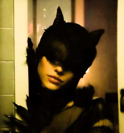 a woman wearing a cat costume in front of a mirror Ariana Grande Halloween Ariana Grande, Catwoman Movie Poster, Ariana Grande Photos, dark olive green