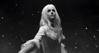 black and white photograph of a woman holding a tennis racquet in the air Halloween 2 2009 Halloween 2007 Movie, Halloween 2 2009, Laurie Halloween 2007, black