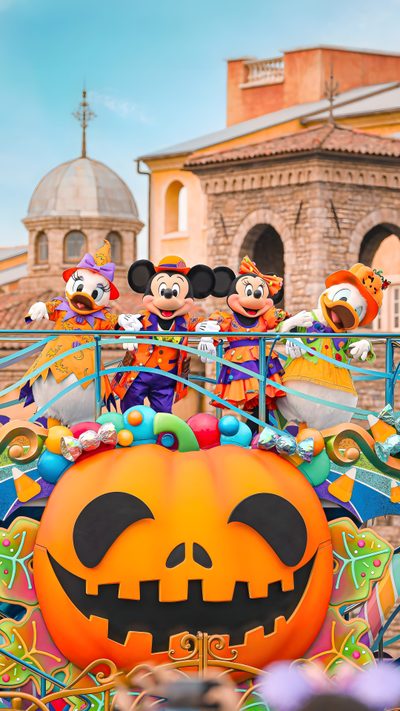 mickey mouse and friends on top of a pumpkin float in disney world's halloween parade Disney World Halloween Disneyland Halloween, Disney Halloween Lockscreen, Disney World Halloween, dark khaki
